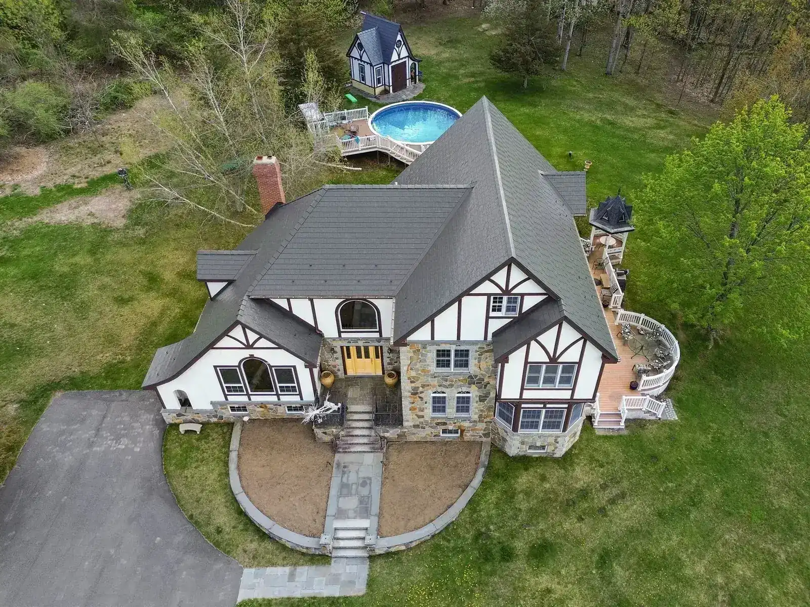 Deep Charcoal Interlock aluminum slate roof on a Tudor home in Madbury, NH